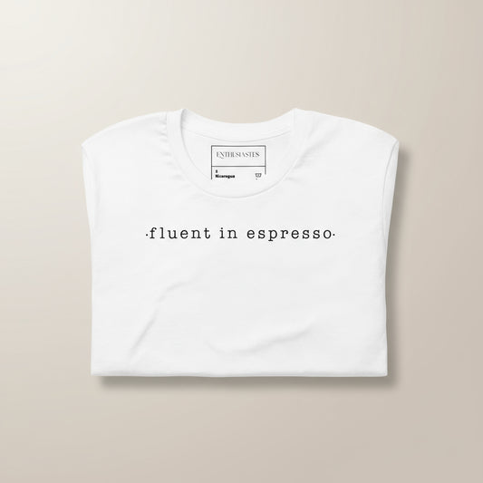 White unisex t-shirt with minimalist script 'fluent in espresso'