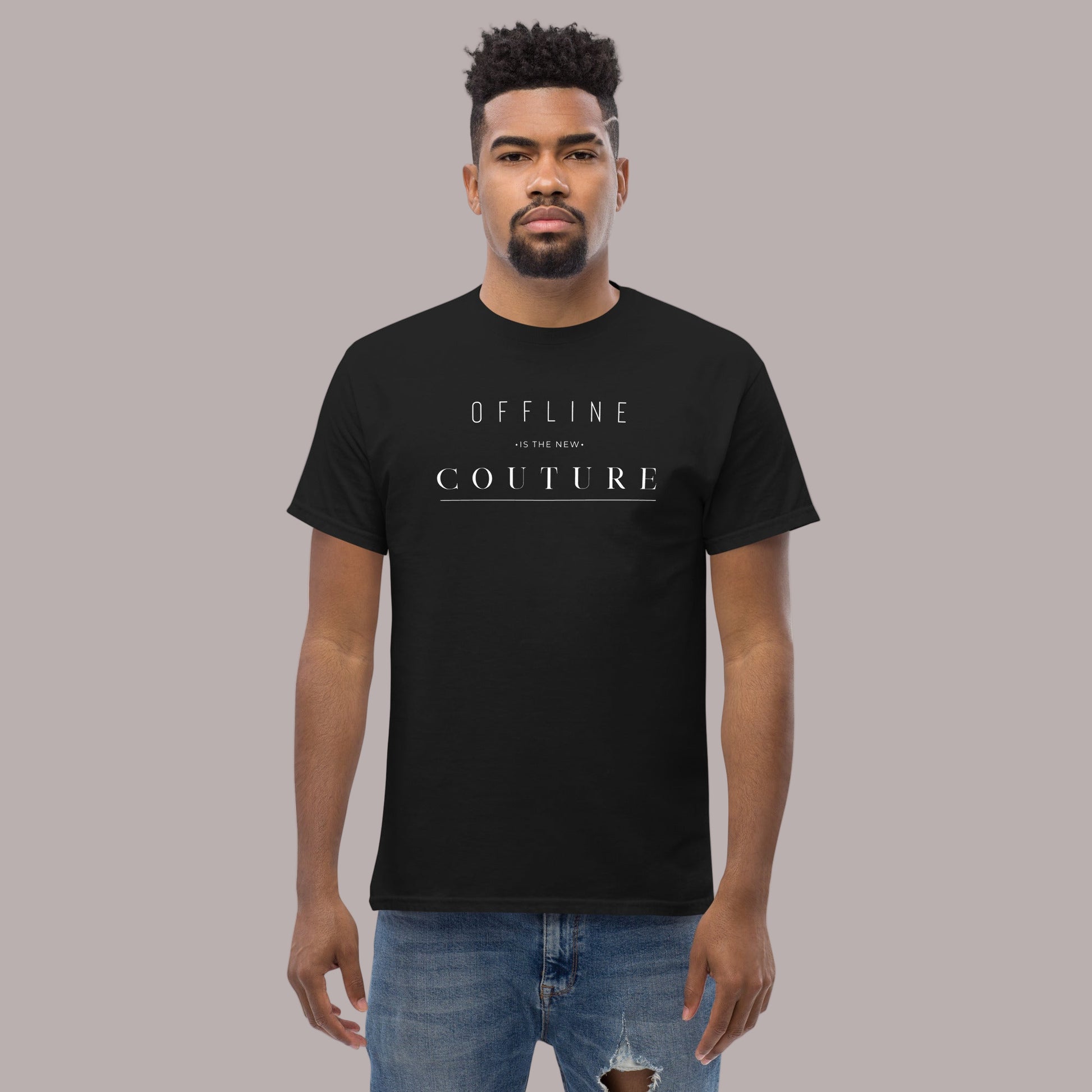 Man wearing a black t-shirt with text “Offline Is The New Couture”