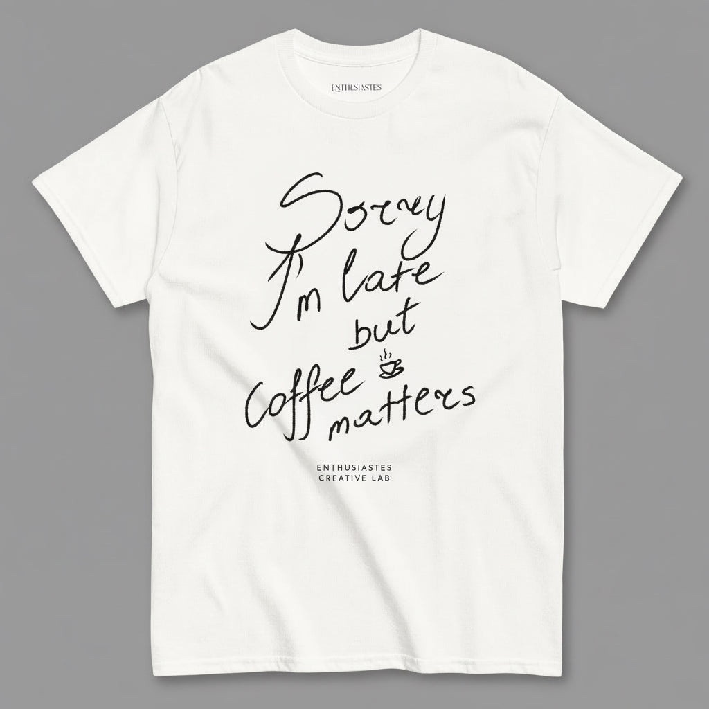 White t-shirt with black text 'Sorry I'm late but coffee matters' on a white background