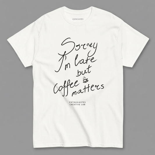 White t-shirt with black text 'Sorry I'm late but coffee matters' on a white background